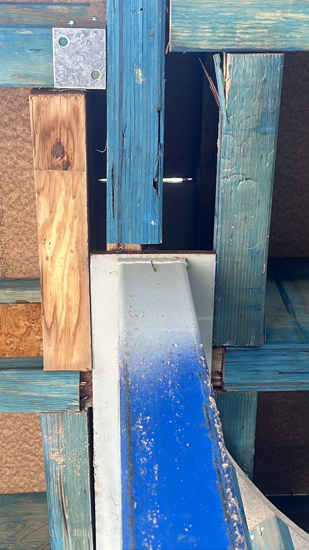 Timber beam reduced in thickness where it bears on a steel post, found during a frame inspection in Gables