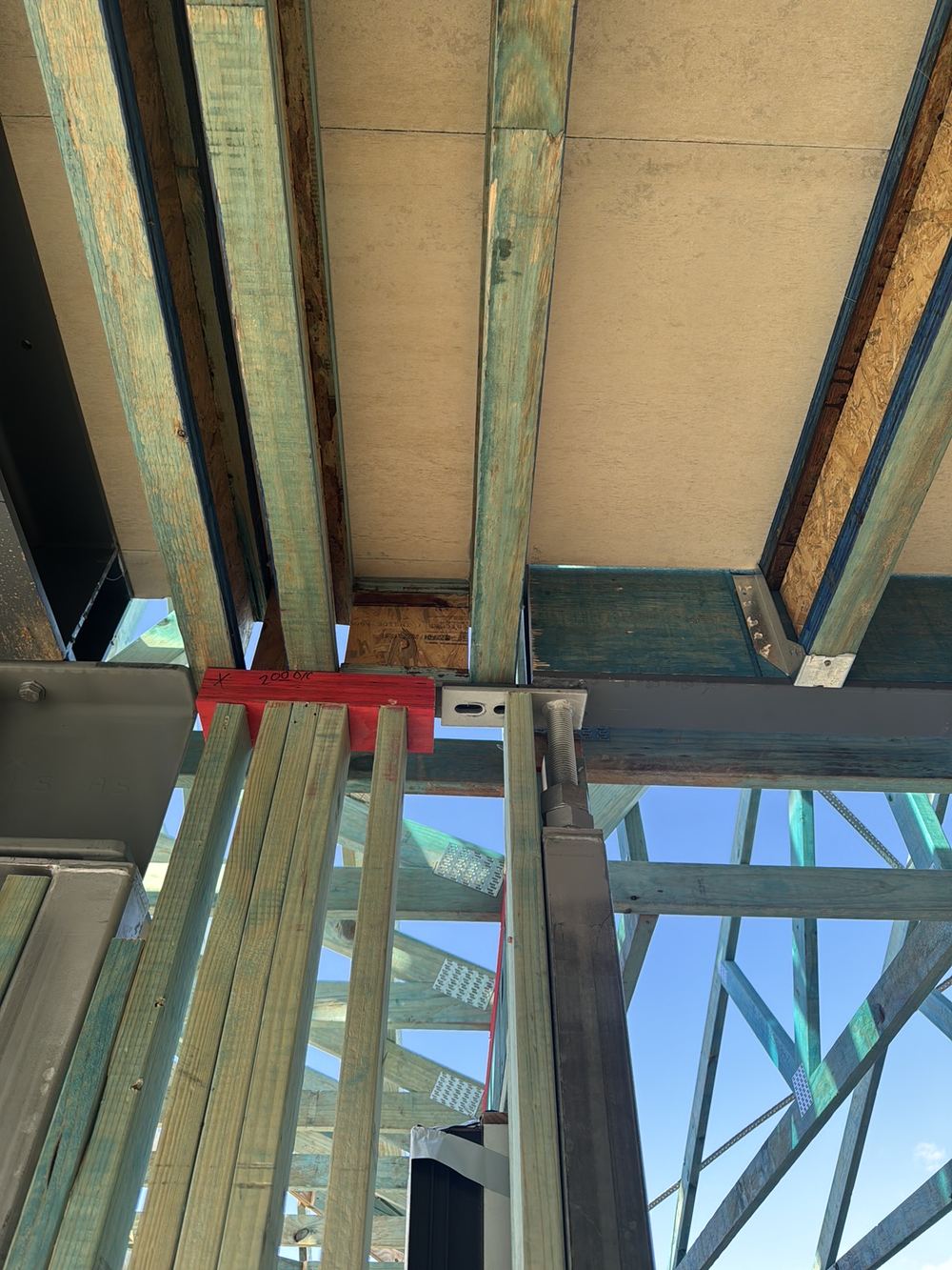 Steel beam support differing from the engineering, so it must be fixed or signed off, Gables
