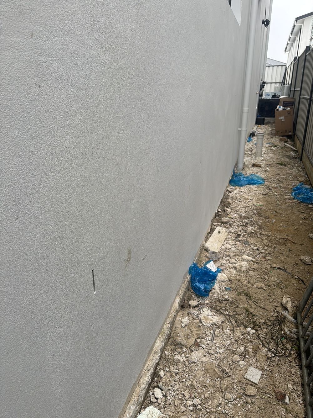 Weep holes spaced more than 1200mm apart, so extra openings are needed, found during a handover inspection in Gables
