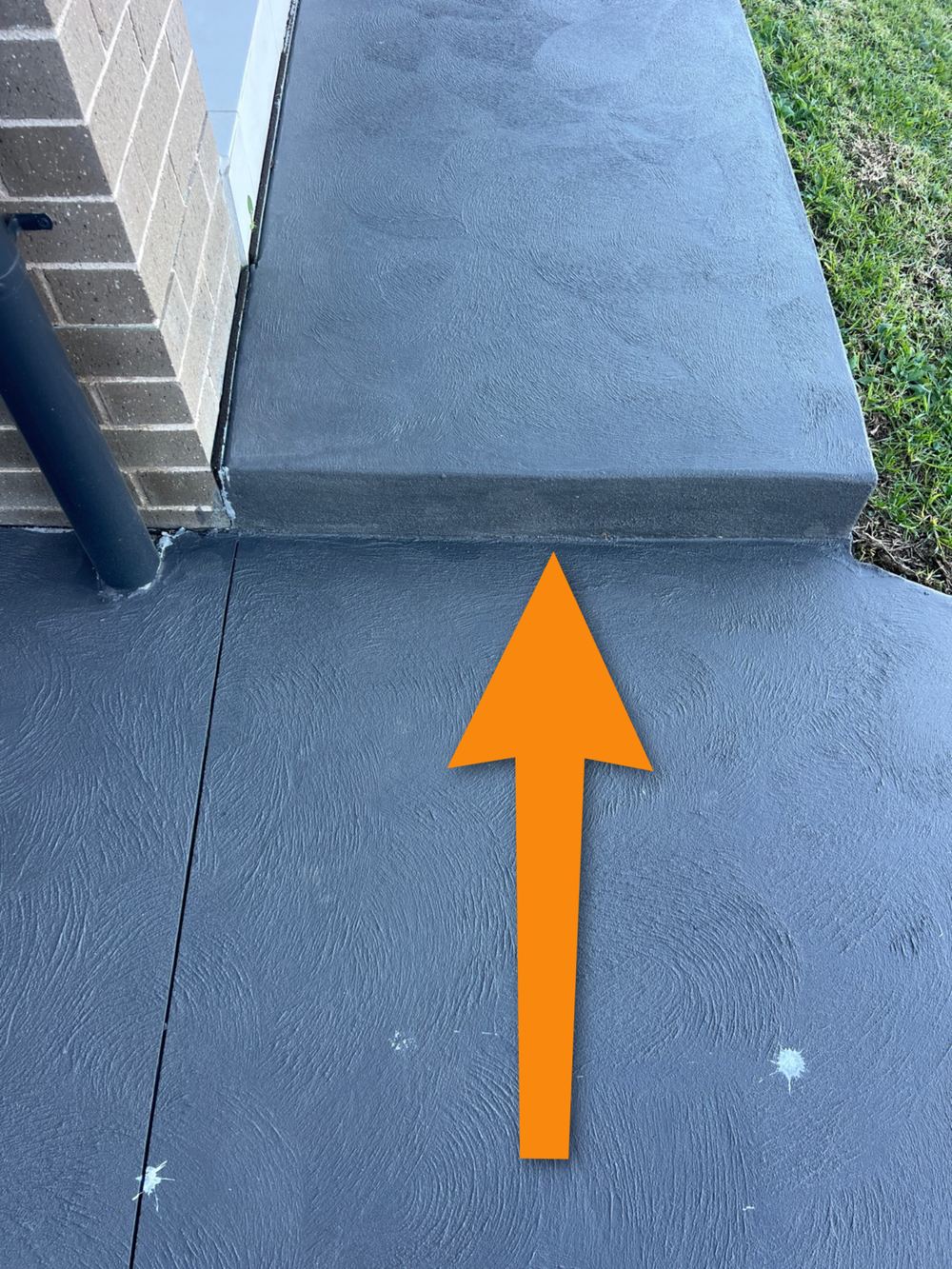 No isolation joint between the house slab and the new path, inviting cracking, Gables
