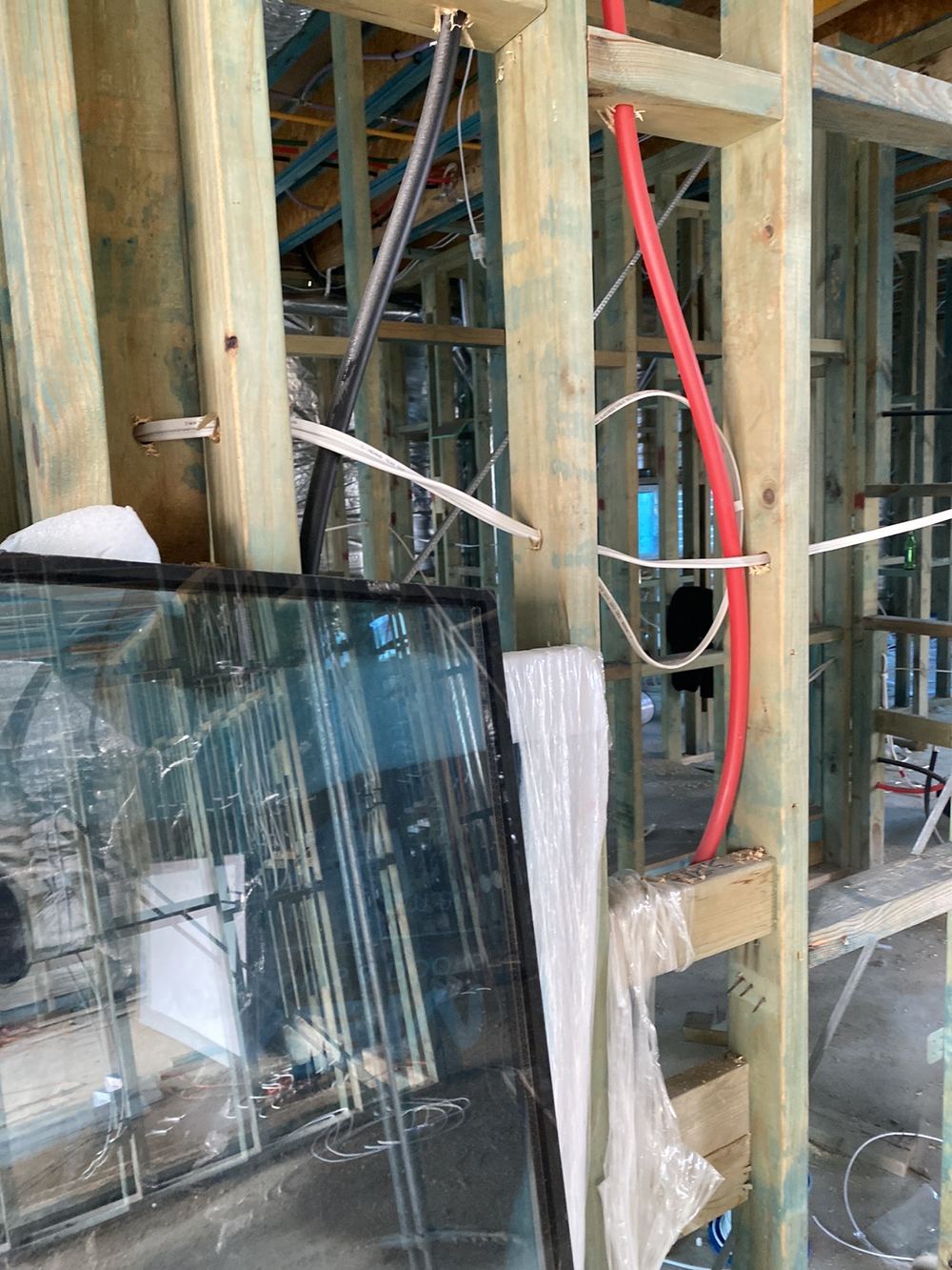 Electrical cables against hot water pipework, inside the 25mm separation required, Gables