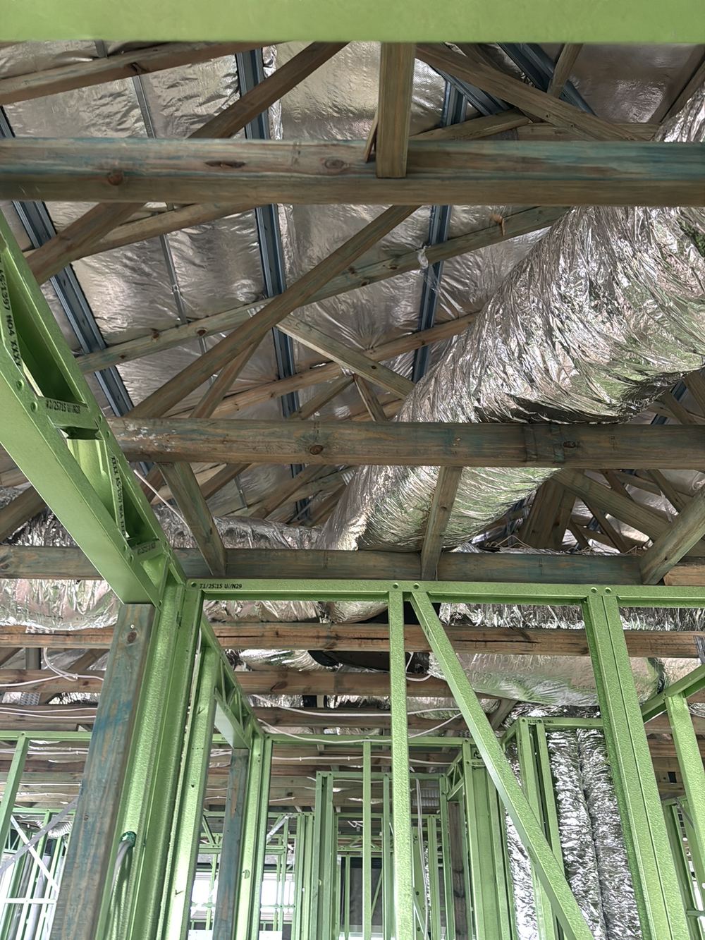 Air conditioning ducting not suspended, so it sags and strains its joints, found during a lock-up inspection in Gables