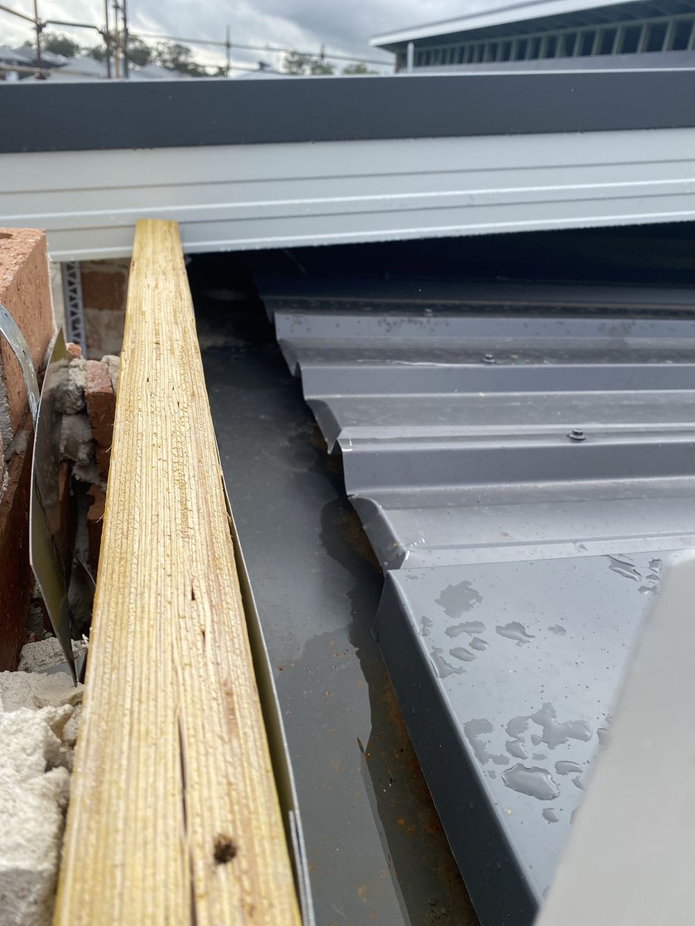 Front box gutter too shallow for the roof area draining into it, found during a lock-up inspection in Gables