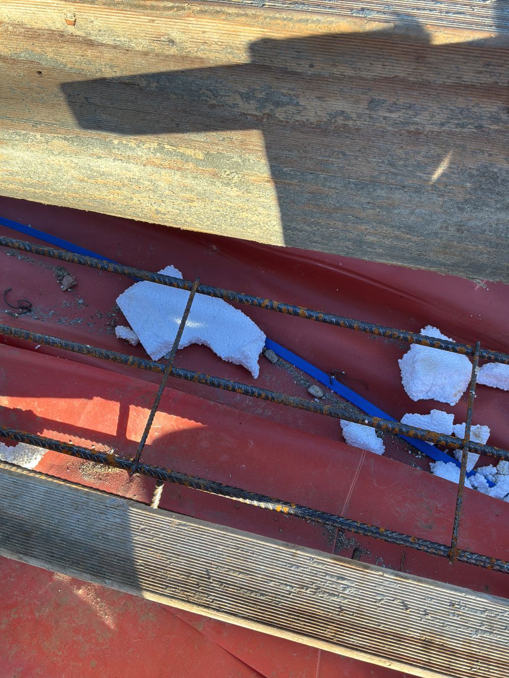 A slab step built without the reinforcement extensions the detail requires, found during a slab pre-pour inspection in Gables